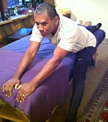 Bill leaning into a stretch over the treatment table
