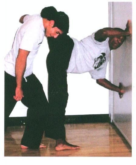A partner-assisted flexion stretch at the wall