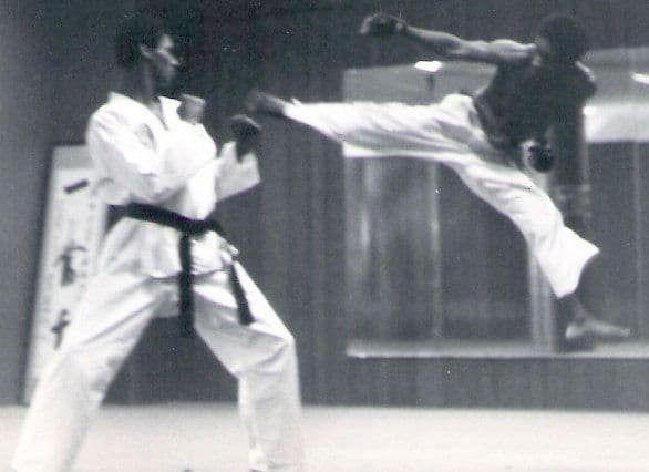 Bill sparring in a Tae Kwon Do jump kick